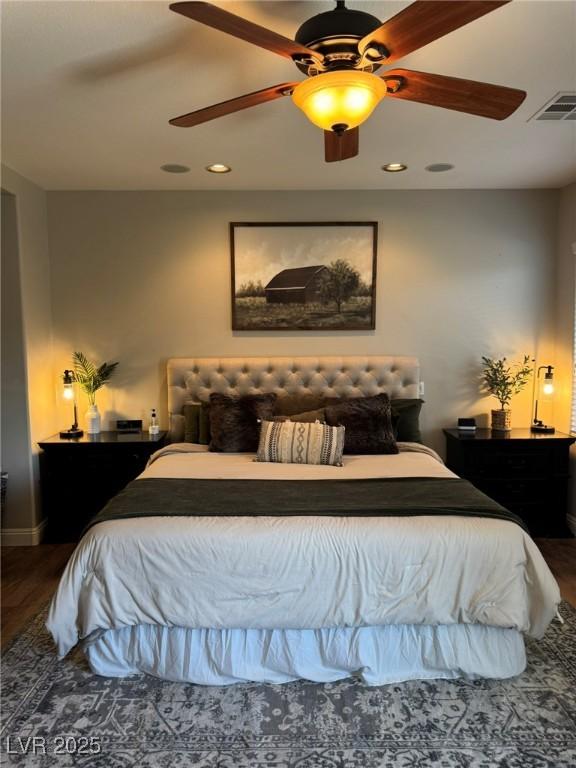 bedroom with ceiling fan, recessed lighting, baseboards, wood finished floors, and visible vents