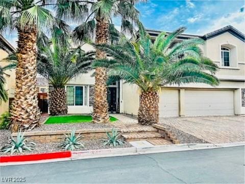7109 Rancho De Taos, Las Vegas, NV 89130 - view of front of property featuring driveway, stucco siding, and a garage