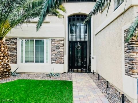 7109 Rancho De Taos, Las Vegas, NV 89130 - property entrance featuring stucco siding and stone siding