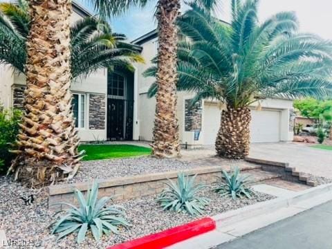 7109 Rancho De Taos, Las Vegas, NV 89130 - view of front of home featuring concrete driveway, stucco siding, and a garage