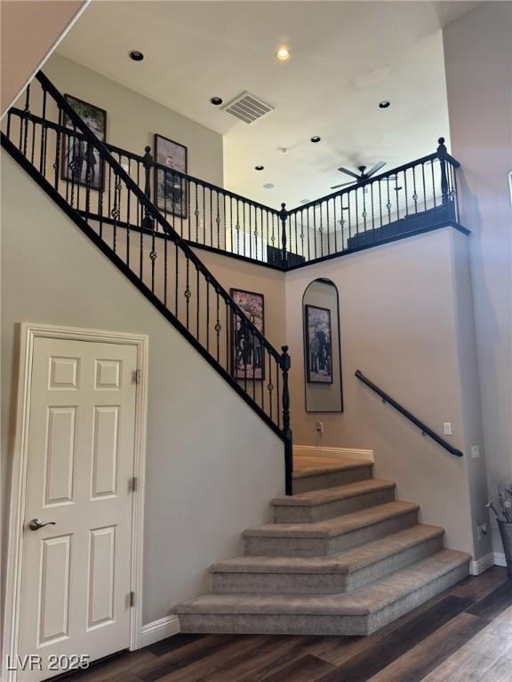 7109 Rancho De Taos, Las Vegas, NV 89130 - stairway with wood finished floors, baseboards, a high ceiling, ceiling fan, and recessed lighting