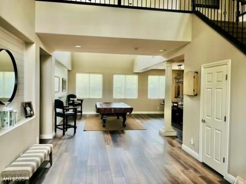 7109 Rancho De Taos, Las Vegas, NV 89130 - playroom with wood finished floors, billiards table, baseboards, and a high ceiling