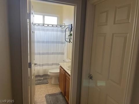 7109 Rancho De Taos, Las Vegas, NV 89130 - bathroom with vanity, toilet, a shower with shower curtain, and tile patterned floors