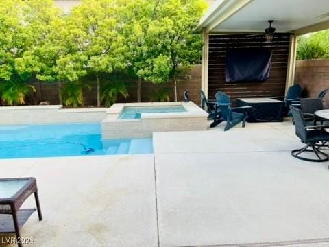 7109 Rancho De Taos, Las Vegas, NV 89130 - view of swimming pool featuring a ceiling fan, a fenced backyard, an in-ground hot tub, and a patio