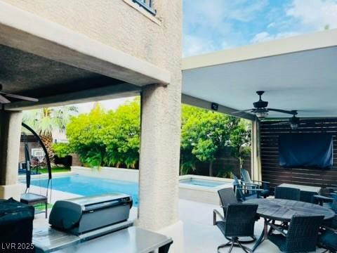 7109 Rancho De Taos, Las Vegas, NV 89130 - view of patio / terrace featuring an in-ground hot tub, a ceiling fan, an outdoor pool, and outdoor dining area