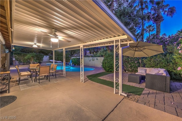 view of patio featuring ceiling fan, outdoor dining area, a fenced backyard, an outdoor hangout area, and a fenced in pool