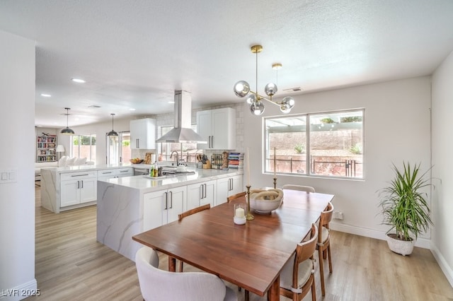 dining space with visible vents, recessed lighting, light wood-style flooring, and baseboards