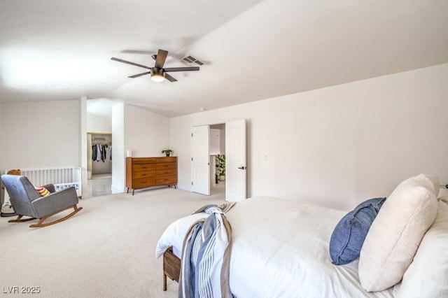 bedroom featuring ceiling fan, light colored carpet, visible vents, lofted ceiling, and radiator
