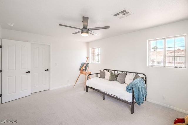 sitting room featuring baseboards, a ceiling fan, carpet flooring, and visible vents