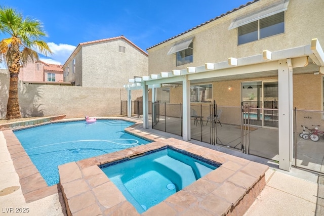 view of pool featuring fence, a fenced in pool, an in ground hot tub, and a patio