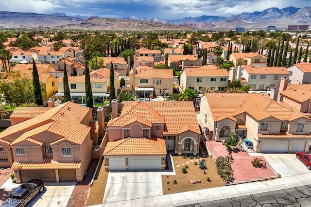 bird's eye view with a residential view and a mountain view