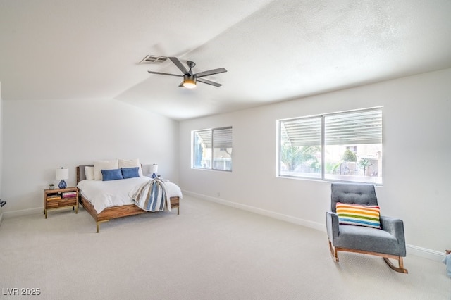 carpeted bedroom with visible vents, a ceiling fan, baseboards, and lofted ceiling