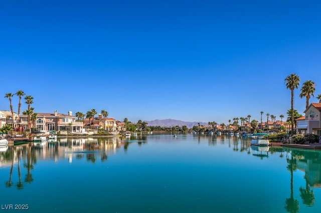 property view of water featuring a mountain view and a residential view