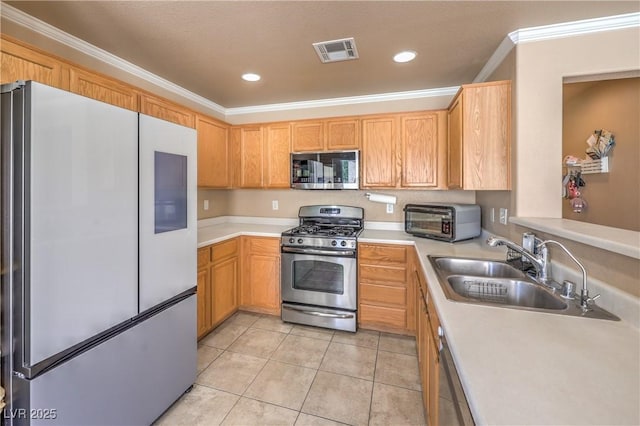 kitchen with visible vents, a toaster, light tile patterned flooring, a sink, and stainless steel appliances