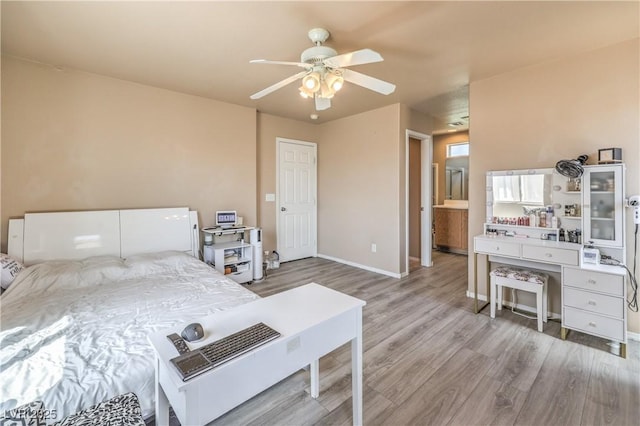 bedroom with baseboards, ceiling fan, and wood finished floors