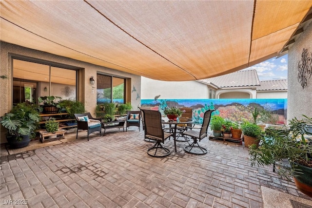 view of patio with outdoor dining space and an outdoor living space
