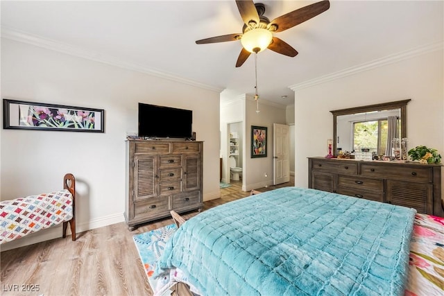bedroom with crown molding, wood finished floors, baseboards, ensuite bathroom, and ceiling fan