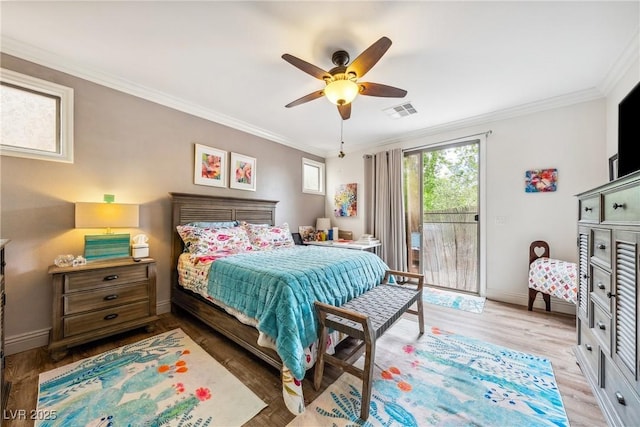 bedroom featuring visible vents, ornamental molding, baseboards, access to outside, and light wood-type flooring