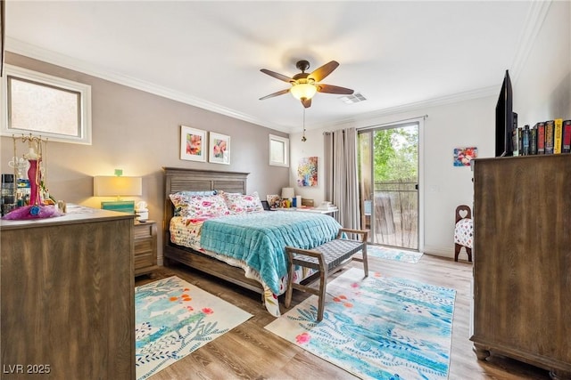 bedroom featuring visible vents, crown molding, wood finished floors, and access to exterior