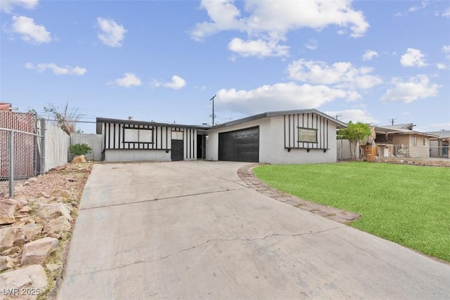 6437 Burgundy Way, Las Vegas, NV 89107 - view of front of home featuring concrete driveway and an attached garage
