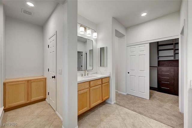 full bathroom with vanity, tile patterned floors, recessed lighting, baseboards, and visible vents