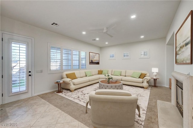 tiled living area featuring ceiling fan, carpet, recessed lighting, baseboards, and visible vents