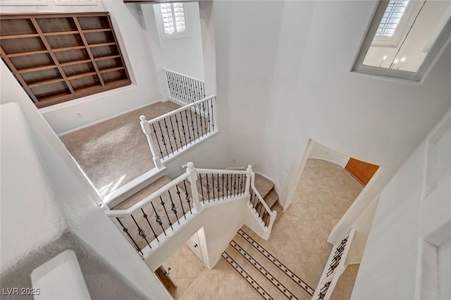 stairs with tile patterned floors