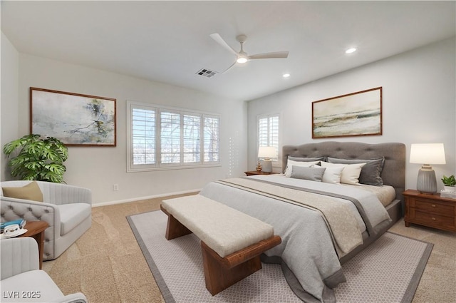 bedroom with light carpet, recessed lighting, baseboards, a ceiling fan, and visible vents