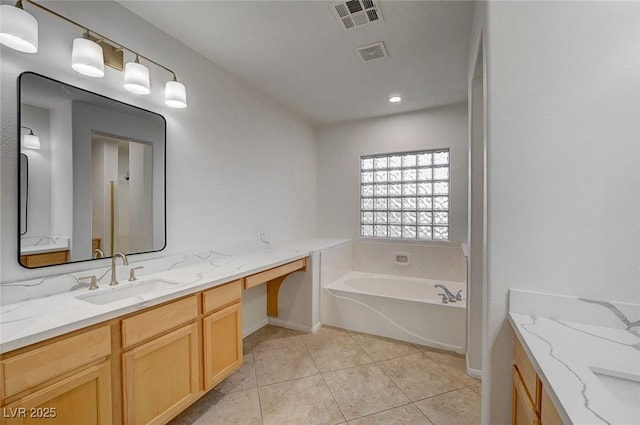 bathroom with baseboards, visible vents, and vanity