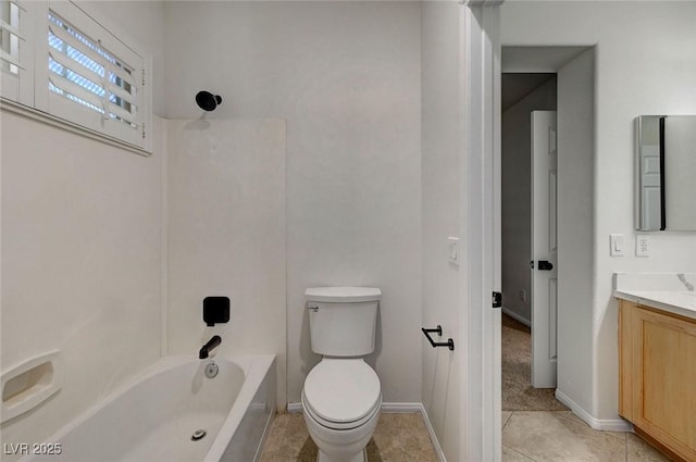 bathroom featuring baseboards, vanity, tile patterned floors, toilet, and shower / bathtub combination