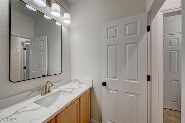 bathroom featuring vanity and tile patterned flooring