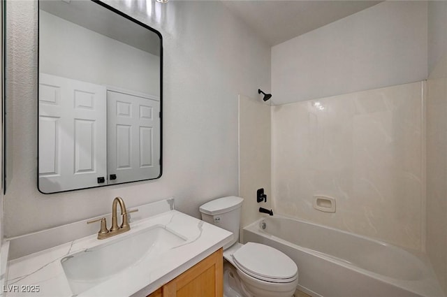 bathroom featuring shower / bath combination, vanity, and toilet