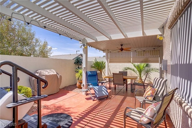 11249 Revelry Ln, Las Vegas, NV 89138 - view of patio with a pergola, a ceiling fan, outdoor dining space, and a fenced backyard