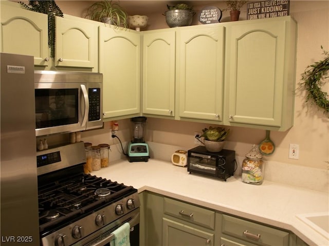 2050 W Warm Springs Rd Unit 411, Henderson, NV 89014 - kitchen featuring light countertops and stainless steel appliances