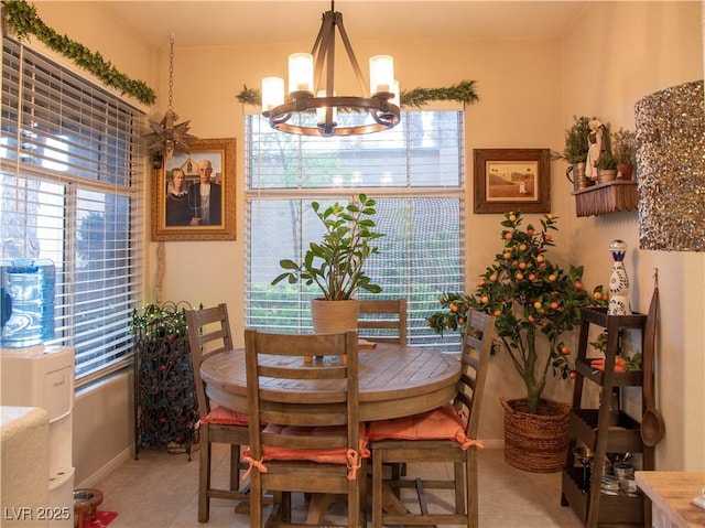 2050 W Warm Springs Rd Unit 411, Henderson, NV 89014 - dining area with baseboards and an inviting chandelier