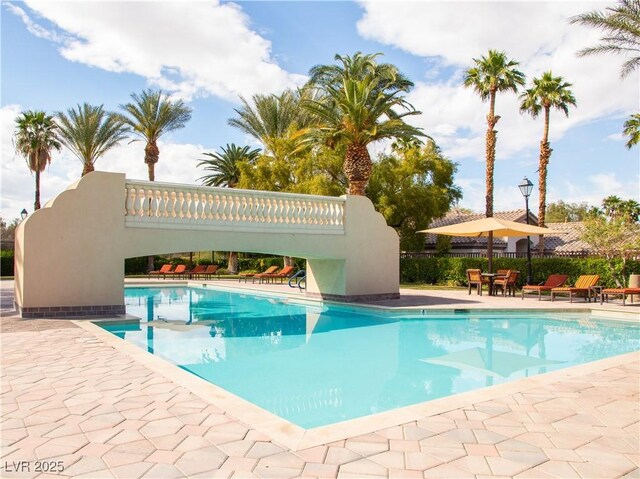 2050 W Warm Springs Rd Unit 411, Henderson, NV 89014 - community pool with a patio and fence