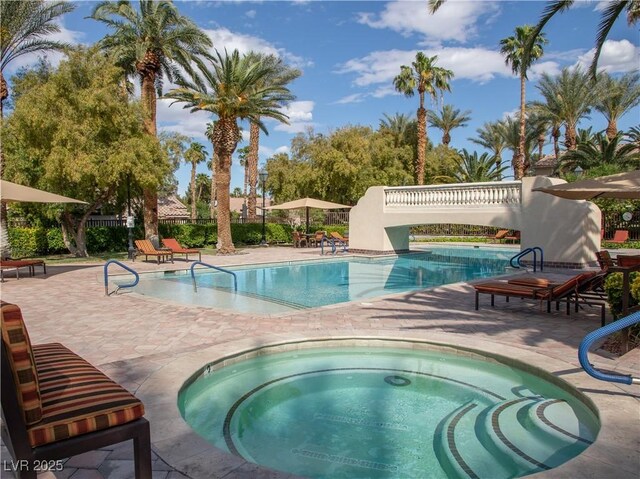 2050 W Warm Springs Rd Unit 411, Henderson, NV 89014 - community pool featuring fence, a community hot tub, and a patio area
