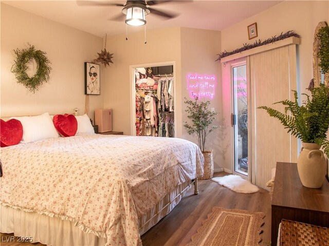 2050 W Warm Springs Rd Unit 411, Henderson, NV 89014 - bedroom featuring ceiling fan, wood finished floors, a closet, a spacious closet, and access to outside