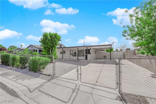 view of front facade featuring fence private yard and a gate
