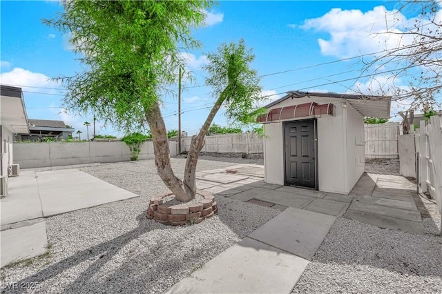 view of shed with a fenced backyard