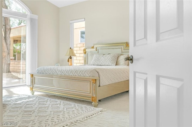 bedroom featuring carpet flooring and access to exterior