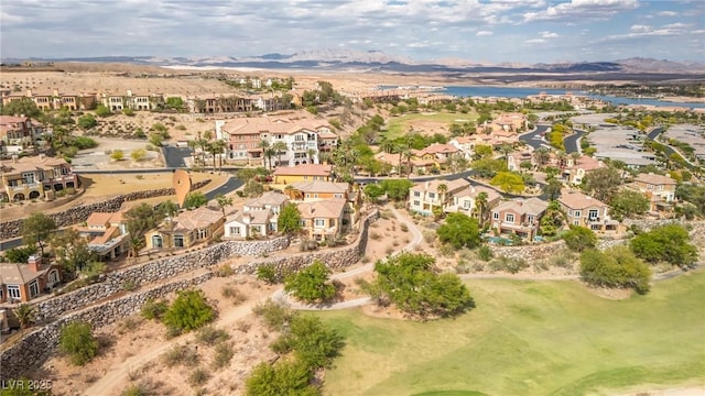 bird's eye view with view of golf course, a residential view, and a water and mountain view