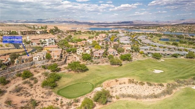 aerial view with a residential view, a water and mountain view, and golf course view