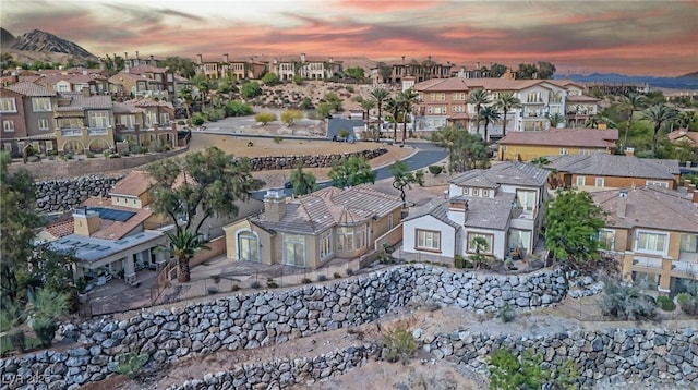 aerial view at dusk featuring a residential view
