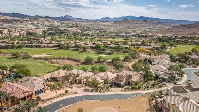 bird's eye view with a residential view, a mountain view, and view of golf course