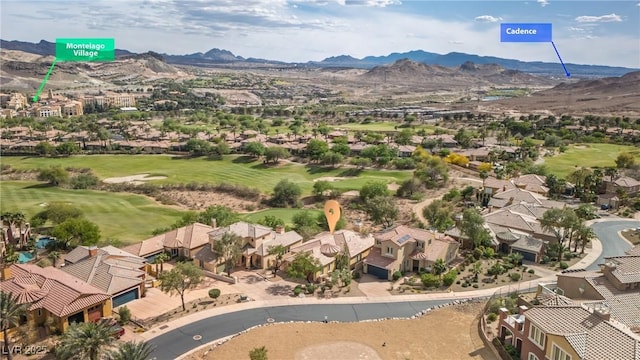 birds eye view of property with view of golf course, a residential view, and a mountain view