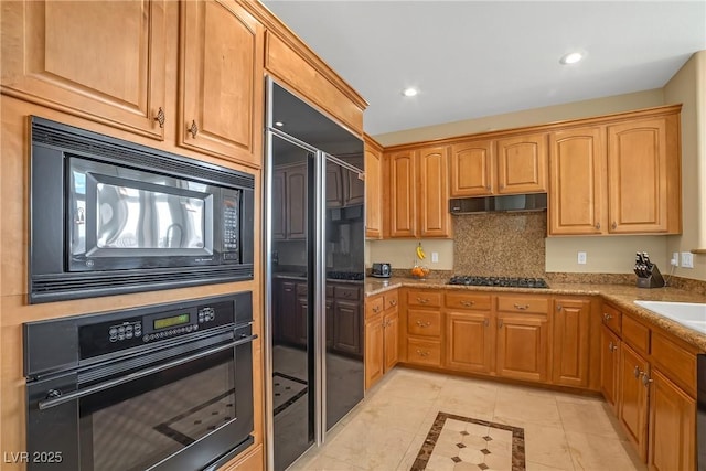 kitchen with recessed lighting, light tile patterned flooring, under cabinet range hood, and black appliances