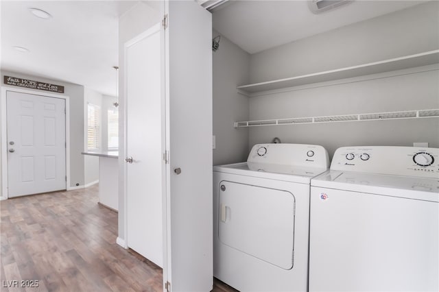 912 Falconhead Ln Unit 101, Las Vegas, NV 89128 - laundry area featuring independent washer and dryer, laundry area, baseboards, wood finished floors, and visible vents