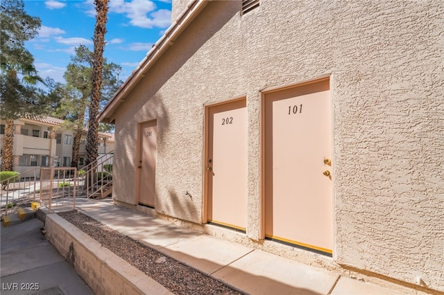 912 Falconhead Ln Unit 101, Las Vegas, NV 89128 - view of home's exterior with stucco siding