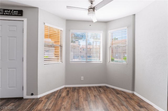 912 Falconhead Ln Unit 101, Las Vegas, NV 89128 - empty room with ceiling fan, baseboards, and wood finished floors